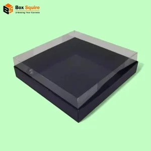 Custom clear lid boxes with a black base from Box Squire, showcasing custom printing on the packaging.