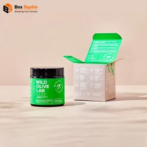 Box Squire custom printed tuck CBD cream boxes with vibrant branding on a sturdy cardboard box.