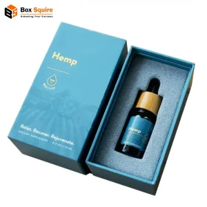 A custom-printed two piece rigid luxury CBD box with a high-gloss finish and gold foil stamping, shown open to reveal a pristine interior with foam inserts, from packaging manufacturer Box Squire.