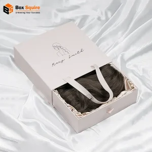 Custom-printed hair extension drawer boxes ribbon handle by Box Squire, showcasing premium packaging with a window pane and gold foil branding.